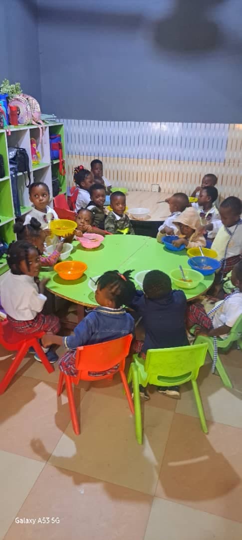 Pre-school students sharing lunch