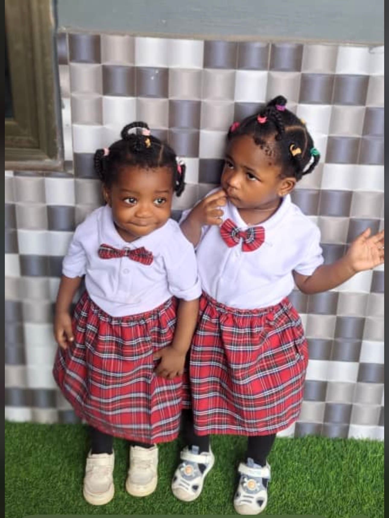 Two pre-school girls in uniform