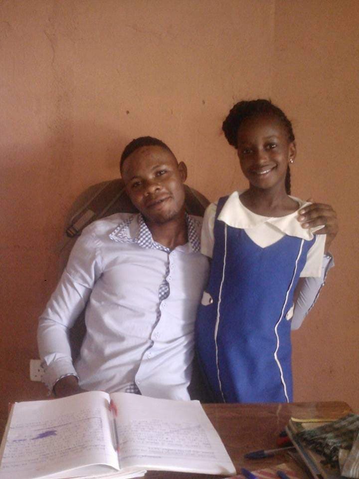 A teacher guiding a student